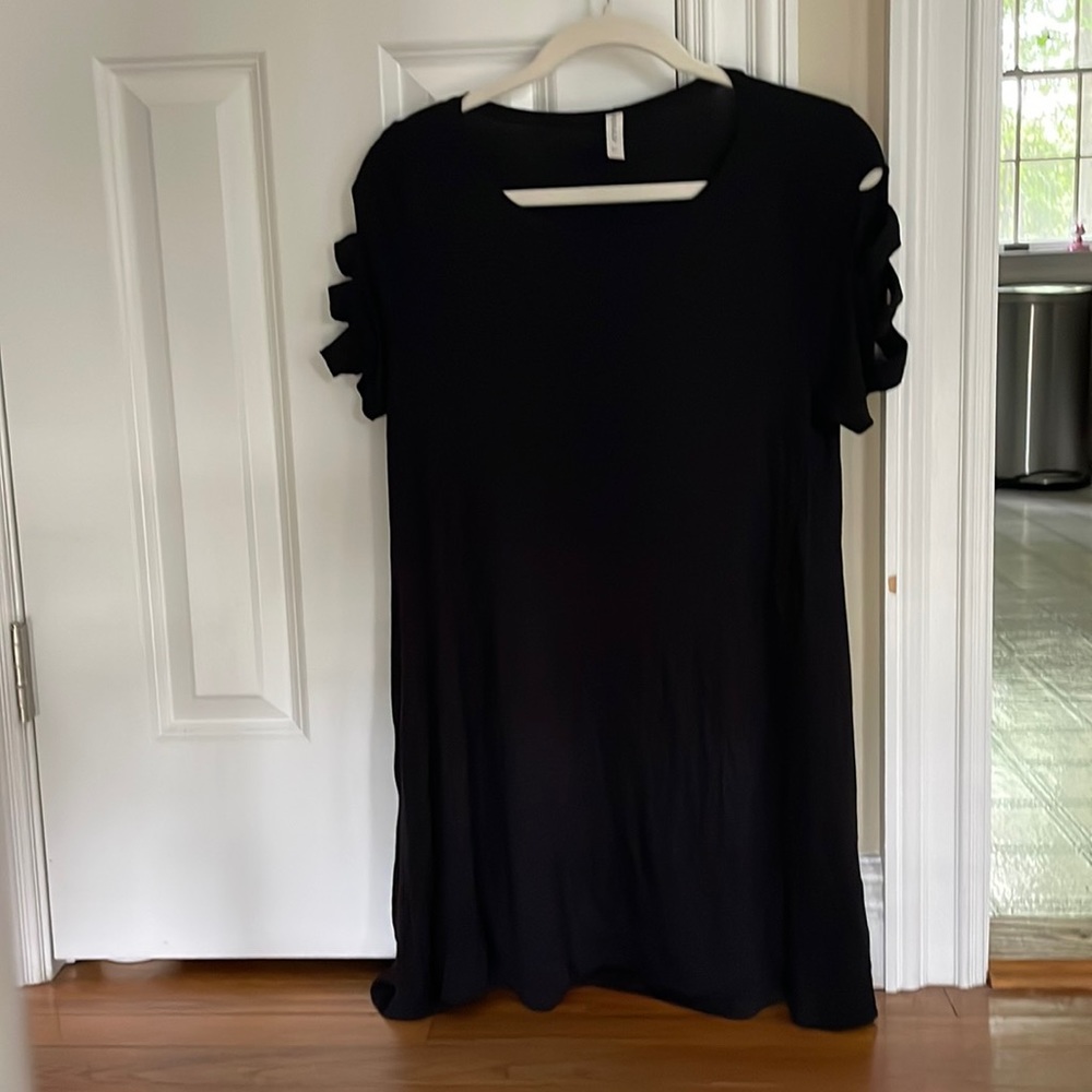 Black shirt for someone who’s a large. Black dress for someone who’s a small.